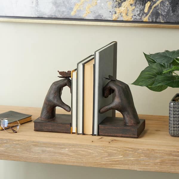 Litton Lane Dark Brown Resin Heart Inspired Hands Bookends with Butterfly and Copper Accents (Set of 2)
