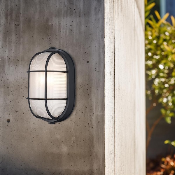 Bel Air Lighting Aria 11 in. 1-Light Black Oval Bulkhead Outdoor Wall Light Fixture with Ribbed Glass