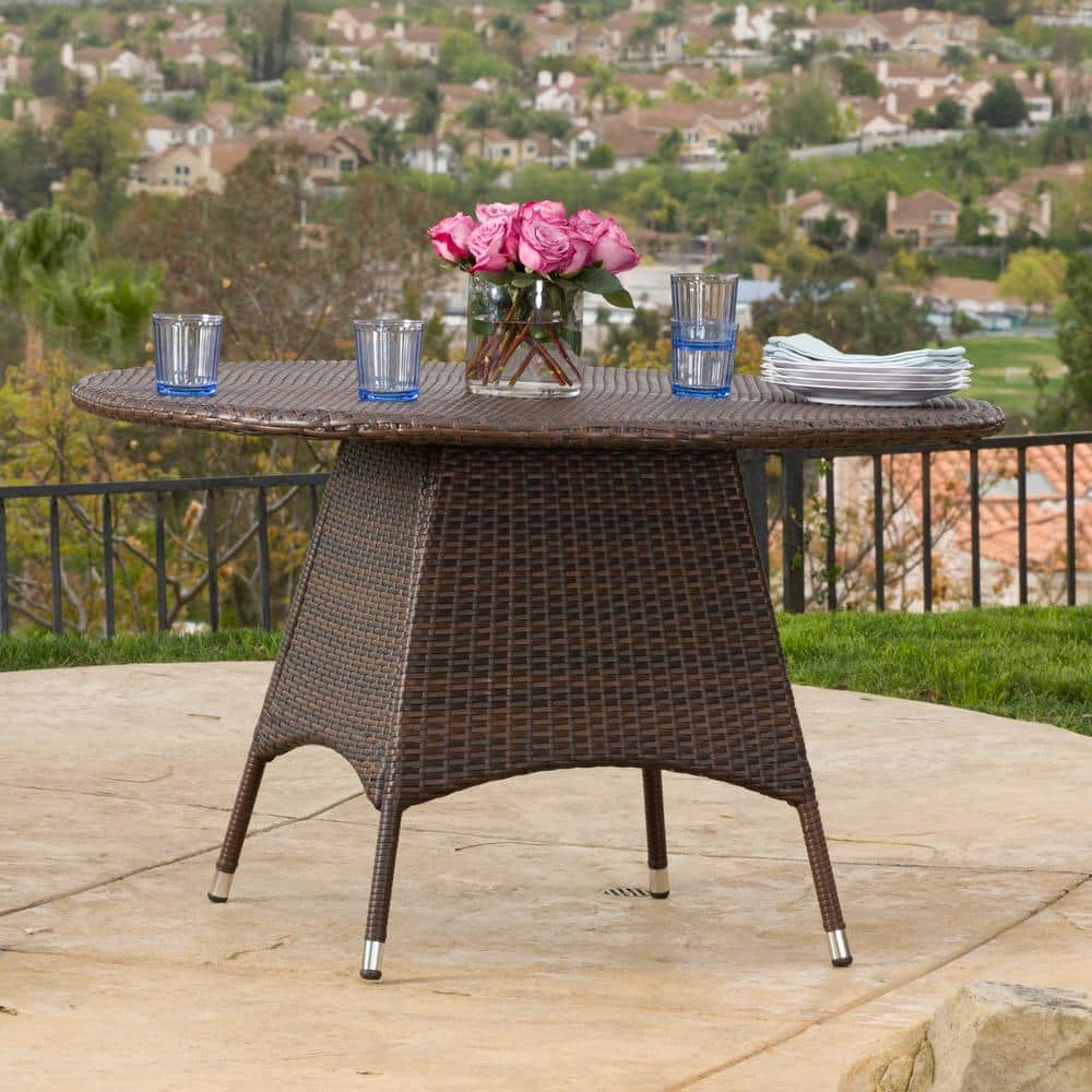 Corsica Brown Round Wicker Outdoor Dining Table with Silver-Tipped Legs