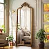 XRAMFY Antique Gold 28 in. W x 69 in. H Arched PU Frame with Ornate Carved Decoration Full Length Mirror Floor Mirror FMPUAC052869GD