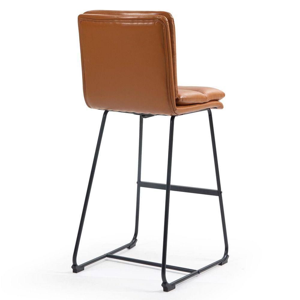 Back view of a light brown upholstered bar stool with a black metal frame.