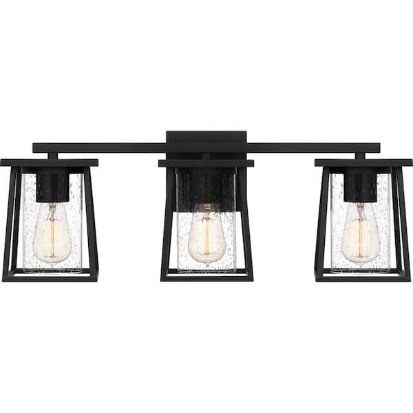 Quoizel Lodge 24 in. 3-Light Matte Black Vanity Light with Clear Seeded Glass