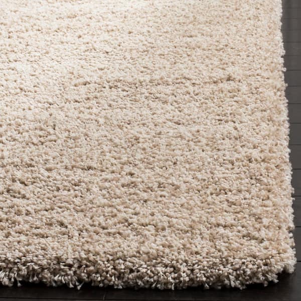 area rug on beige carpet