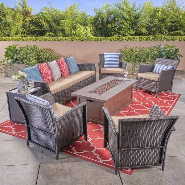 Noble House St. Lucia Brown 7-Piece Faux Rattan Patio Fire Pit Conversation Set with Tan Cushions