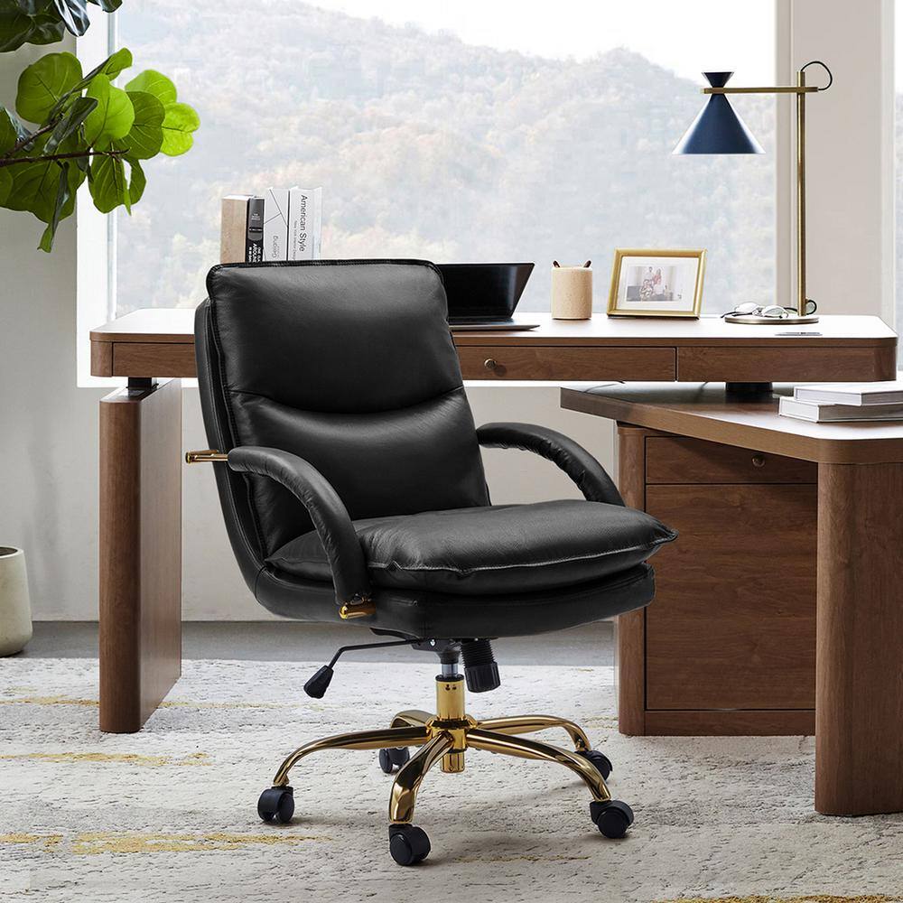 Calel black leather office chair positioned at a wooden desk