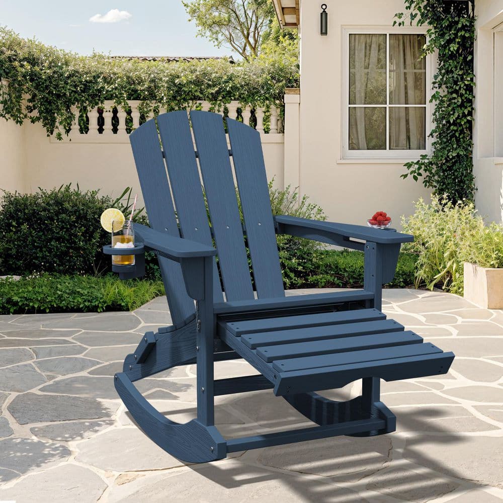 Navy blue Adirondack chair on a stone patio.