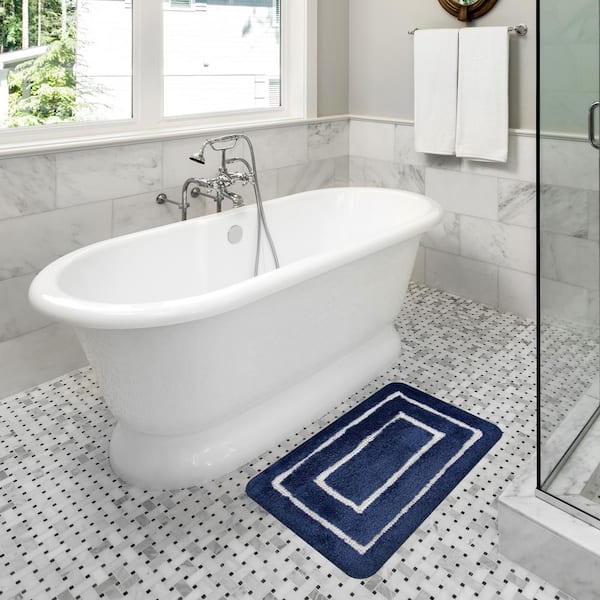 https://images.thdstatic.com/productImages/a16e125f-9a77-4f79-8e99-3d927f337a31/svn/navy-bathroom-rugs-bath-mats-85bor540624x60-31_600.jpg