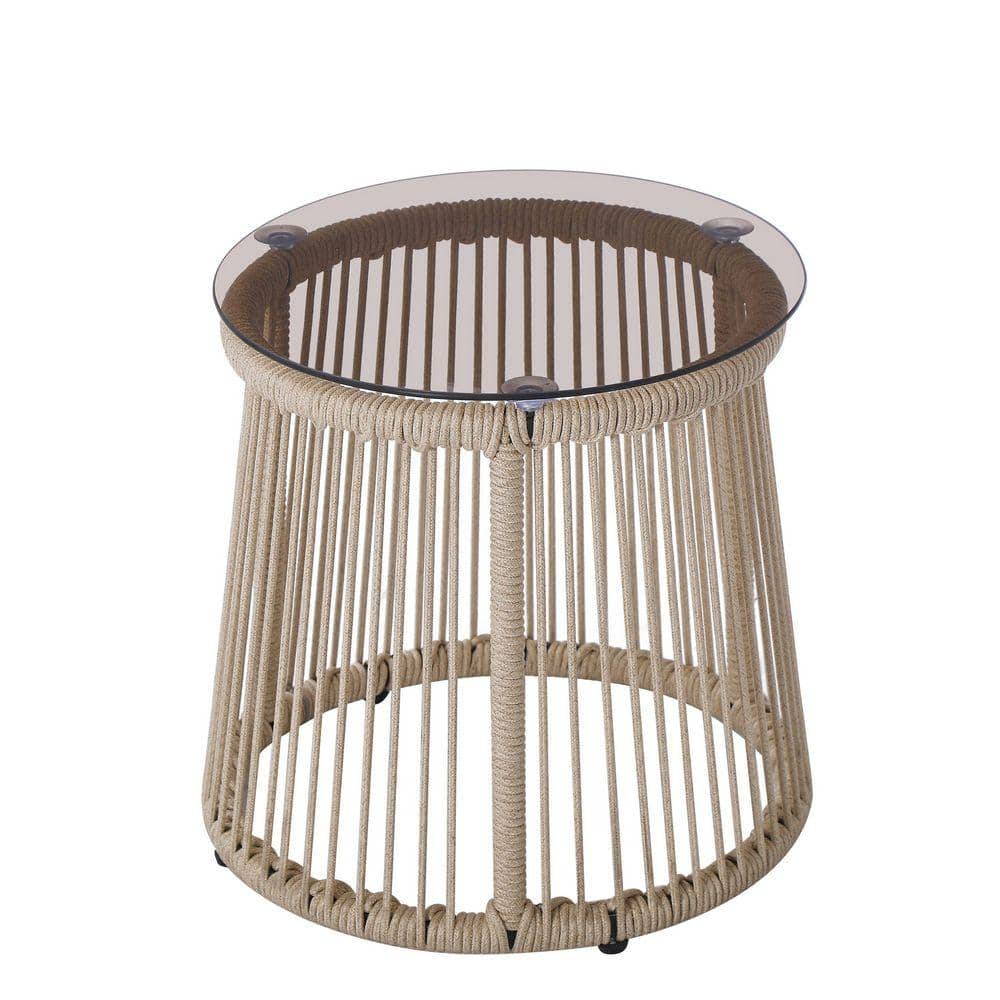 A high-angle view of a round light brown woven rope side table with a glass top.