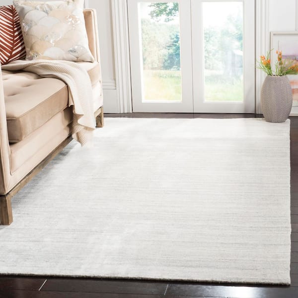 Mirage 5 ft. x 8 ft. Ivory/Gray Distressed Solid Color Area Rug