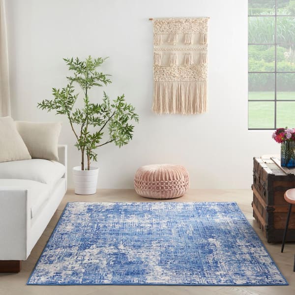 https://images.thdstatic.com/productImages/a1f0178a-aff2-5678-bfa9-4091e1257886/svn/blue-ivory-nourison-area-rugs-832856-4f_600.jpg