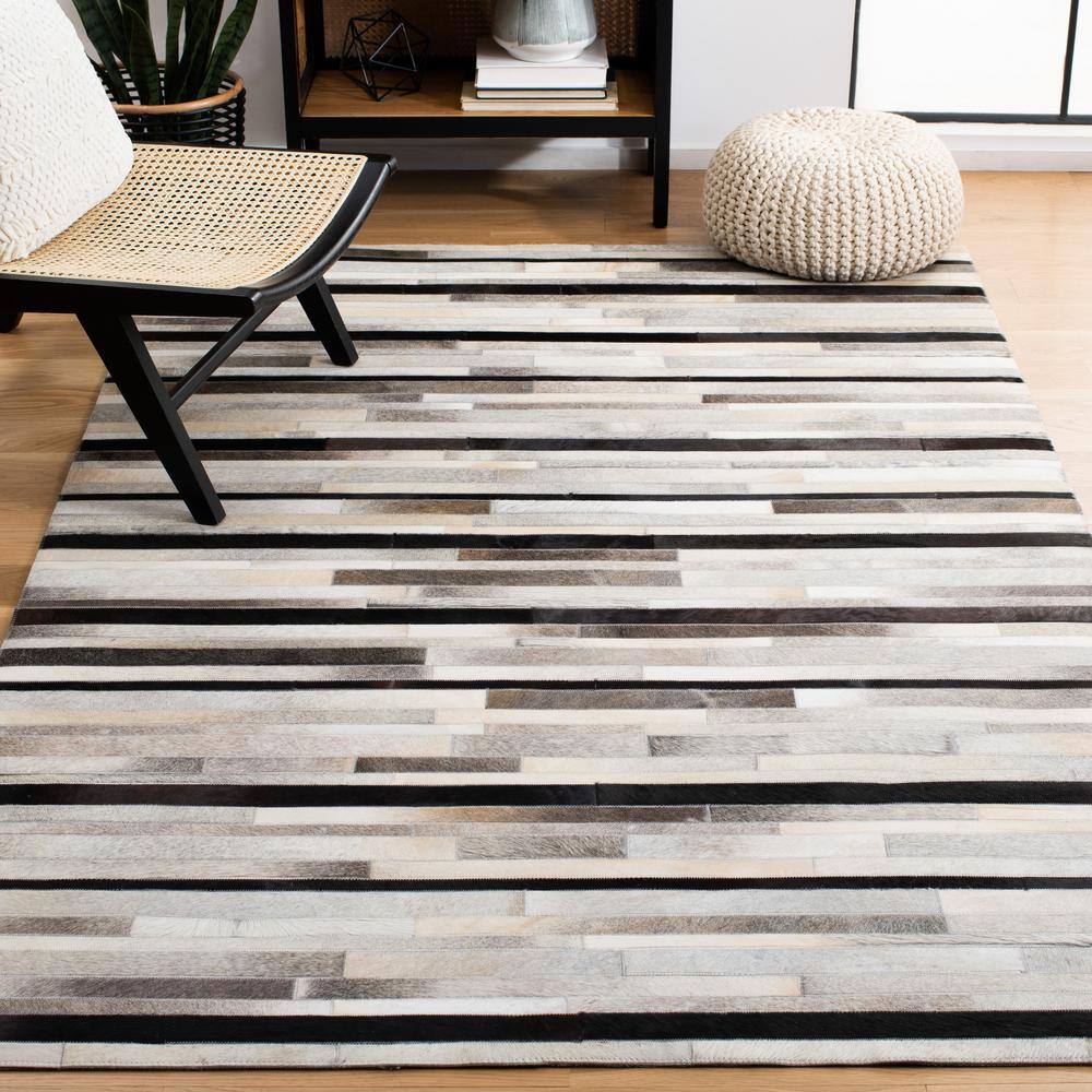 Handmade Black and Ivory Geometric Cowhide Area Rug