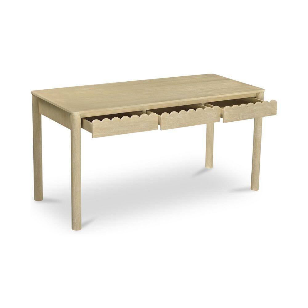 Natural mango wood desk with three drawers pulled out showing scalloped edges.