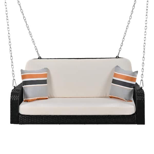 WELLFOR 2-Person Black PE Wicker Porch Swing with Beige Back/Seat Cushions and Pillows