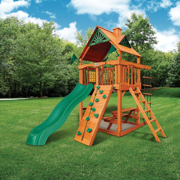 Gorilla Playsets Chateau Tower Wooden Outdoor Playset with Picnic Table, Wave Slide, Rock Wall, Sandbox, and Swing Set Accessories