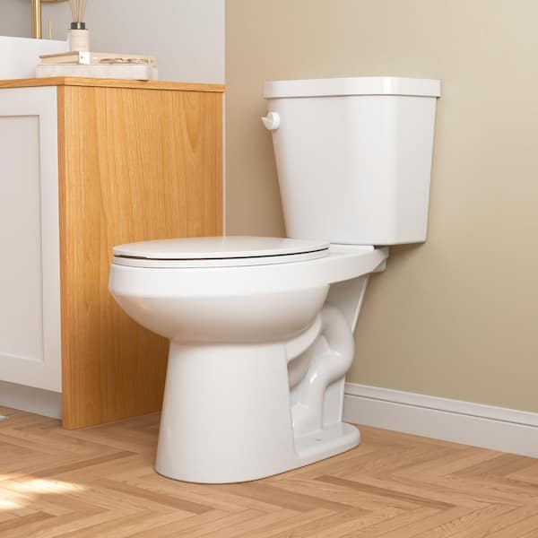 2-Piece 1.28 GPF Single Flush Elongated ADA Chair Height Toilet in White, Slow-Close Seat Included