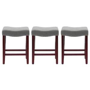 Jameson 24 in. Counter Height Cherry Wood Finish Backless Nail Head Barstool with Gray Linen Saddle Seat (Set of 3)