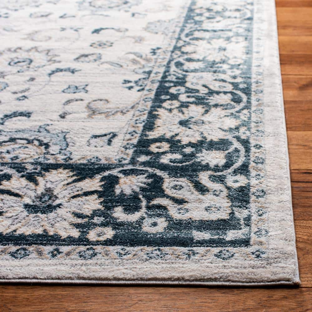 Isabella Cream and Navy 4' x 6' Synthetic Oriental Area Rug