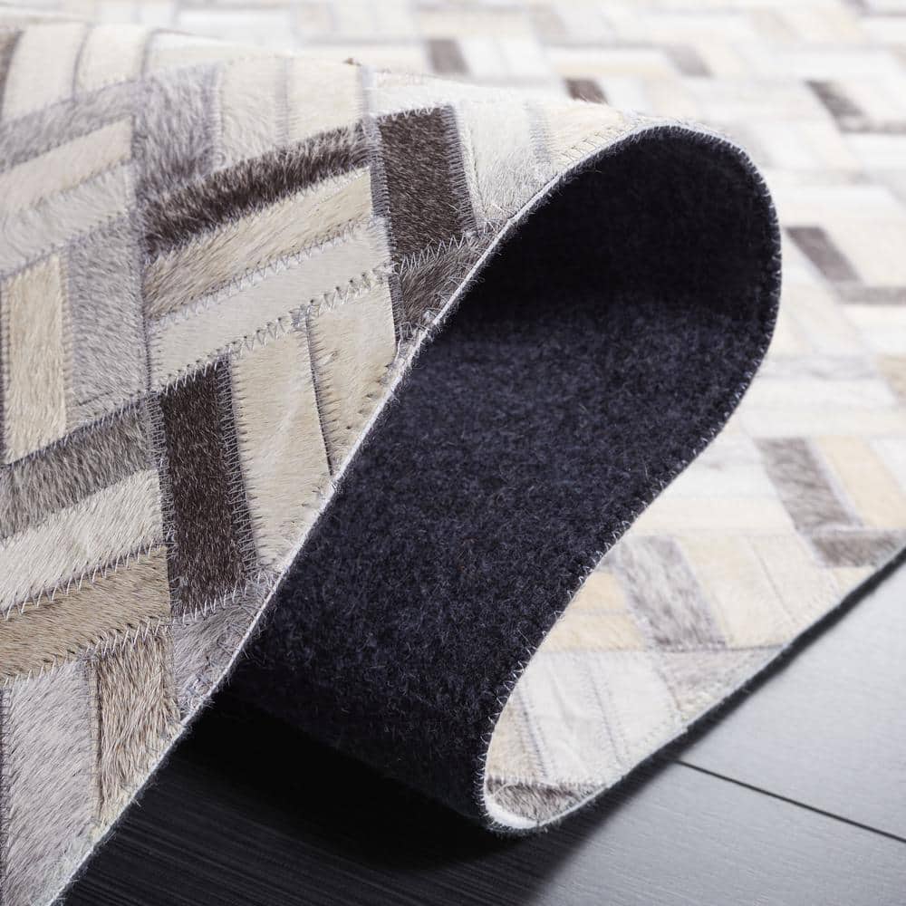 Handmade Black and Gray Geometric Cowhide Area Rug