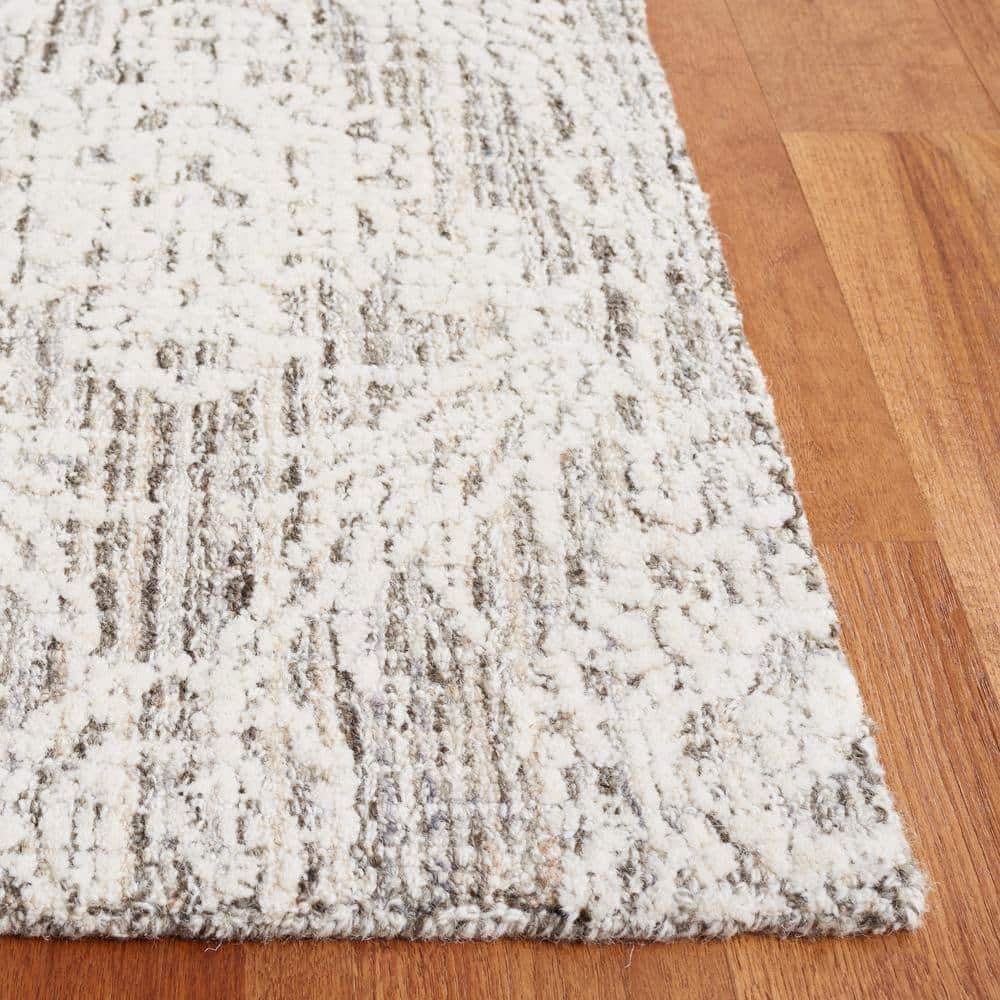 Ivory and Gray Tufted Wool 8' x 10' Area Rug