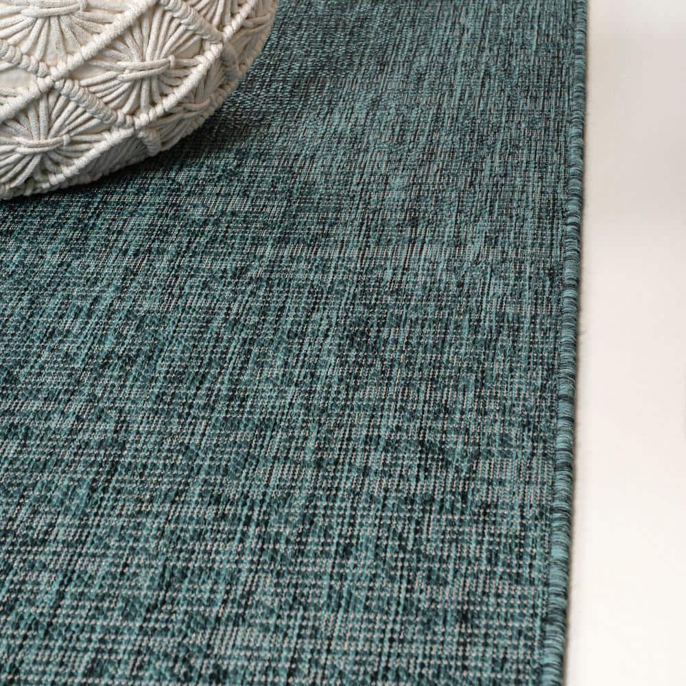 Turquoise and Cream 4' x 6' Solid Synthetic Area Rug