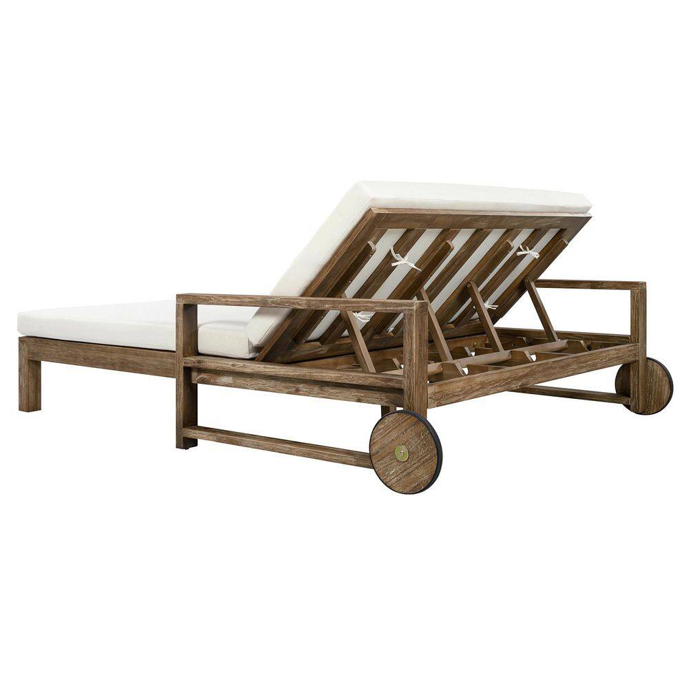 Wooden outdoor daybed with slatted back design outdoors.