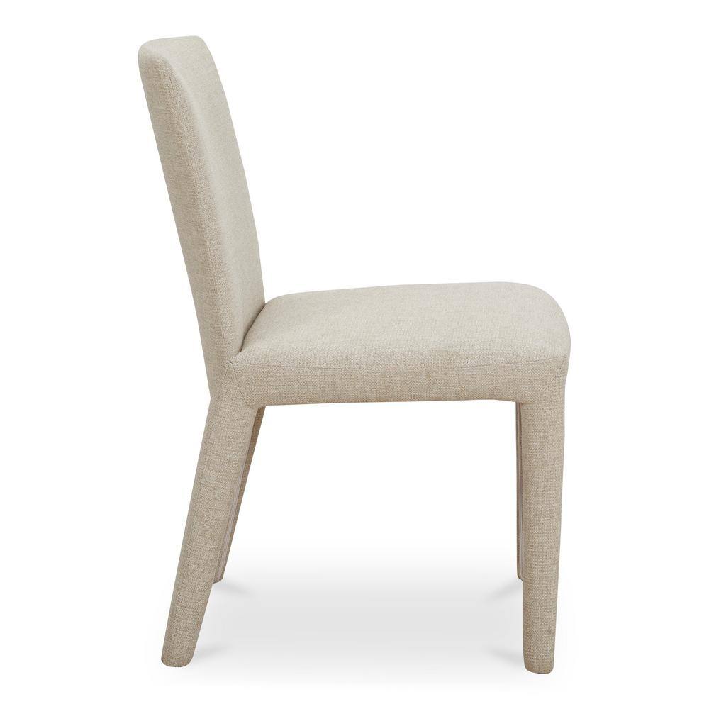 Side view of a Mirabel beige upholstered dining chair.