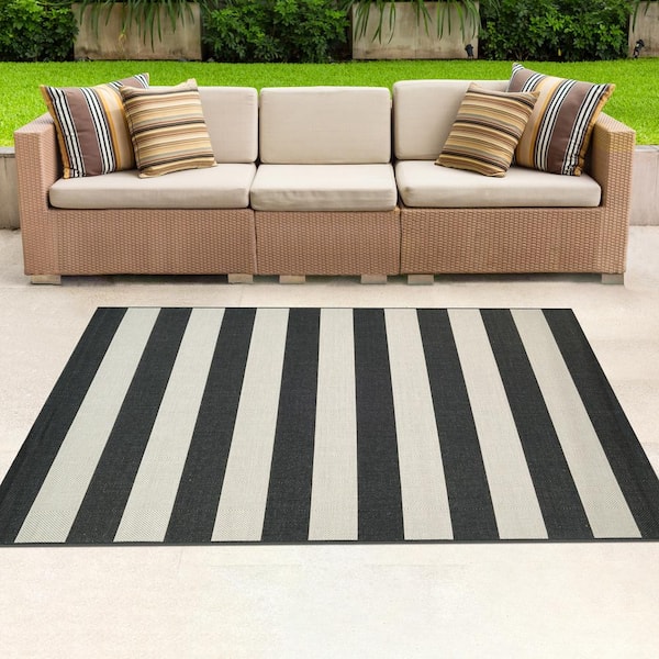 https://images.thdstatic.com/productImages/a3e71e88-c618-43fd-800c-146b26304abd/svn/onyx-ivory-couristan-outdoor-rugs-52299081710109t-e1_600.jpg