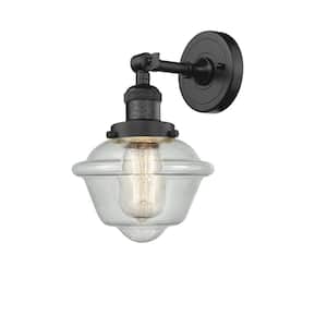 Oxford 7.5 in. 1-Light Oil Rubbed Bronze Wall Sconce with Seedy Glass Shade