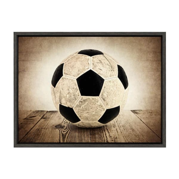 DesignOvation Sylvie "Vintage Soccer on Wood" by Saint and Sailor Studios Sports Framed Canvas Wall Art 24 in. x 18 in.