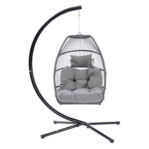1-Person Black Metal Frame Patio Swing with Brown Rattan Basket and Grey Cushion and Pillow