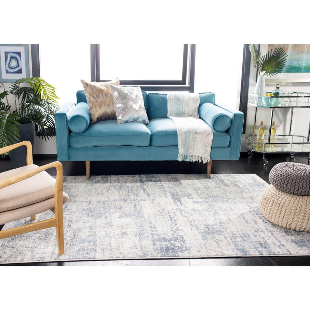 Ivory and Blue Abstract 8' x 10' Synthetic Area Rug