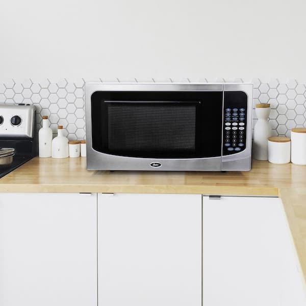 https://images.thdstatic.com/productImages/a4c35453-4a06-4539-920f-8a324a39bc7f/svn/stainless-steel-trim-silver-cabinet-oster-countertop-microwaves-985115673m-31_600.jpg