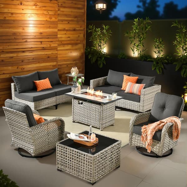 XIZZI Enchanted 9 Pieces Wicker Outdoor Patio Rectangular Fire Pit Set and Swivel Rocking Chairs with Black Cushions