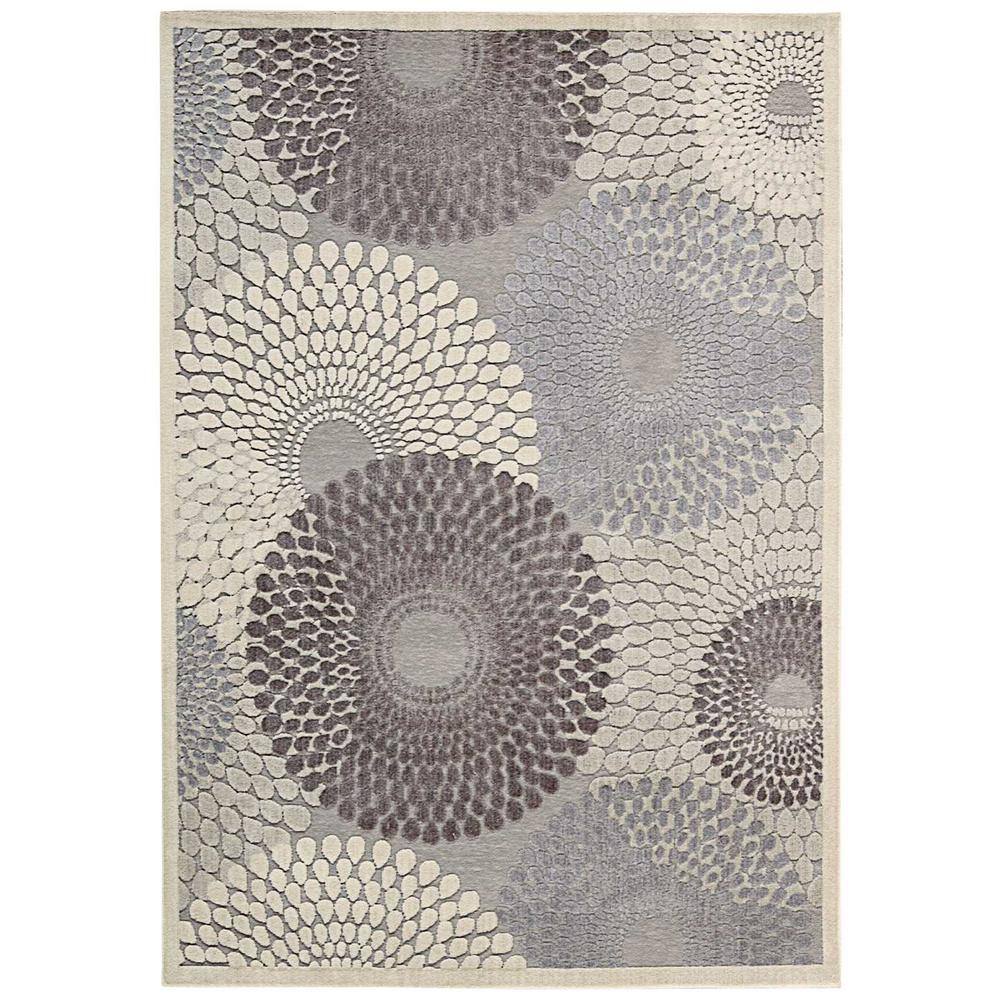 Nourison Graphic Illusions Grey 5 ft. x 7 ft. Geometric Modern Area Rug Fill your room with warmth and style with the Nourison Graphic Illusions 5 ft. x 7 ft. Area Rug. Adorned with geometric accents, this rug achieves the perfect combination of traditional and chic that will work well with any decor. It comes in a gray shade, so it complements your other home accessories for a simple interior design solution. With a 70% acrylic construction, this rug will be an extremely durable choice for any living space. Color: Grey.
