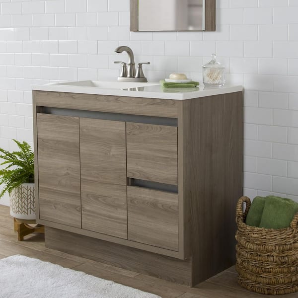 https://images.thdstatic.com/productImages/a4ebd0fc-e783-4137-9f00-75c1ae0ae79f/svn/home-decorators-collection-bathroom-vanities-with-tops-b36x20146-40_600.jpg
