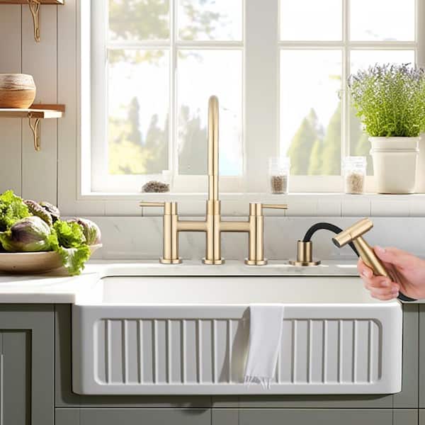 Double Handle Bridge Kitchen Faucet with Side Sprayer in Brushed Gold