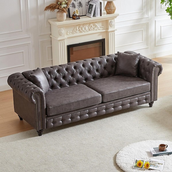 Beryl 85.5 in. Rolled Arm Faux Leather Upholstered Rectangle Tufted Chesterfield Sofa in Grey with Pillows, Nailhead