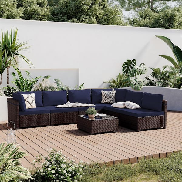 7-Piece Wicker Patio Conversation Seating Set with Navy Blue Cushions and Coffee Table