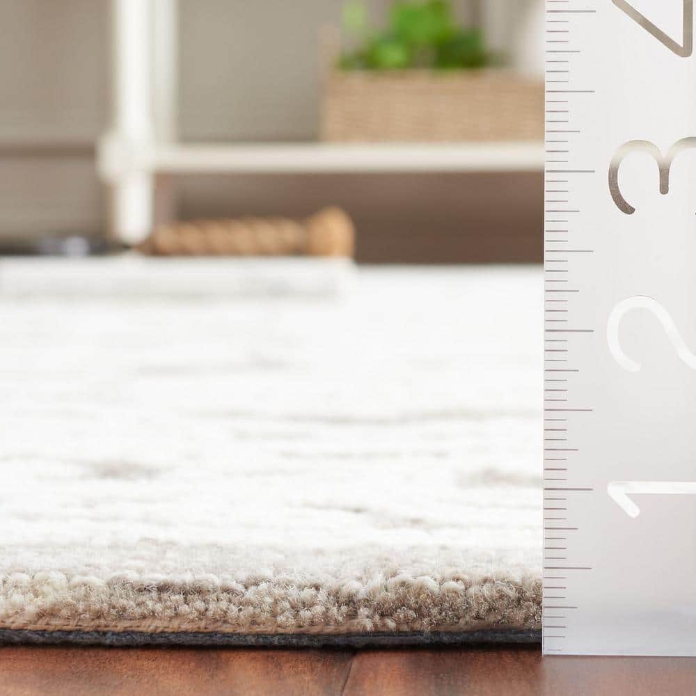 Ivory and Dark Grey 4' x 6' Hand Tufted Wool Area Rug