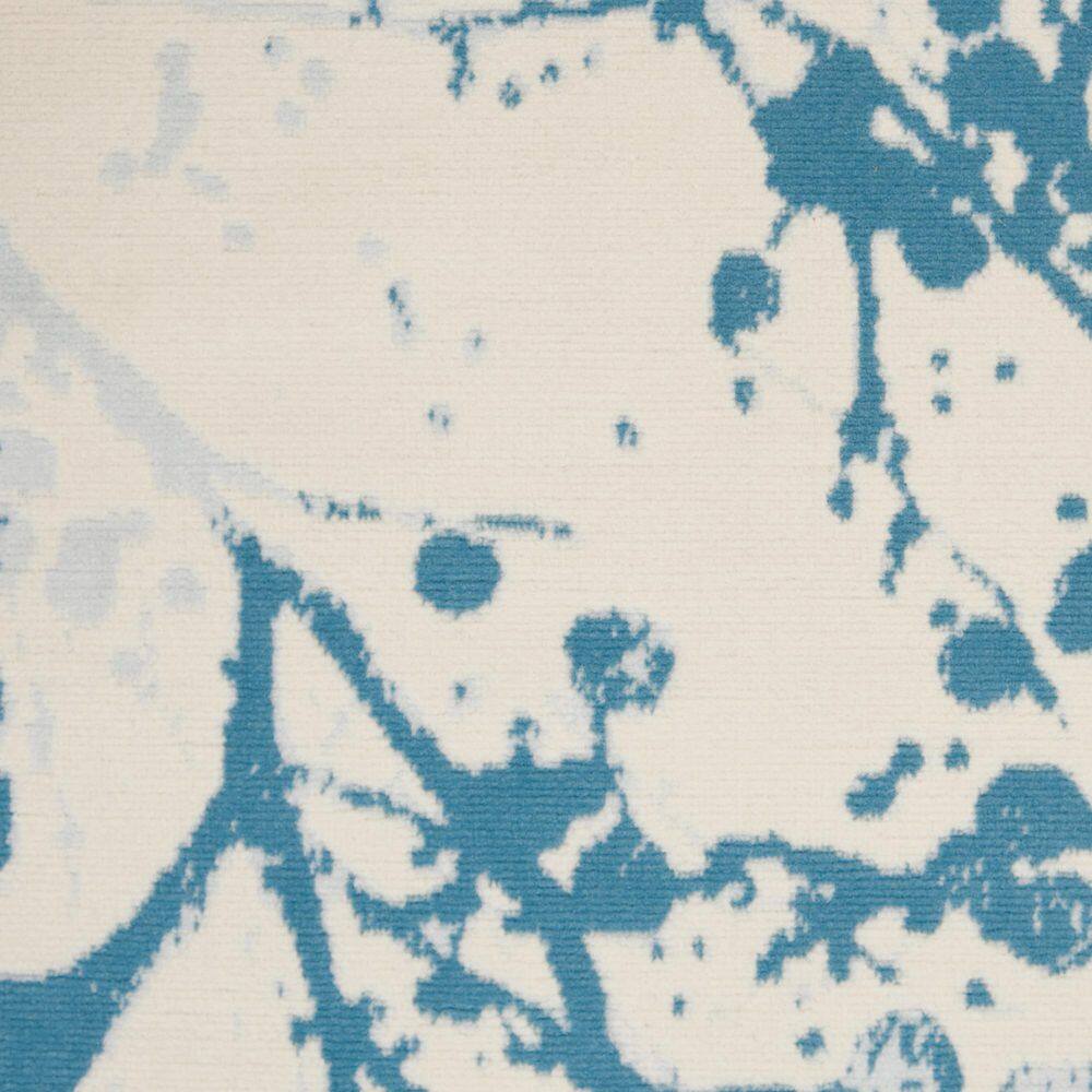 Ivory and Blue Abstract Synthetic 4' x 6' Easy-Care Area Rug
