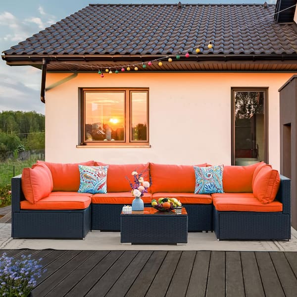 Cesicia Black Frame 7-Piece Wicker Patio Conversation Set with Orange Cushions Pillows and Glass Table