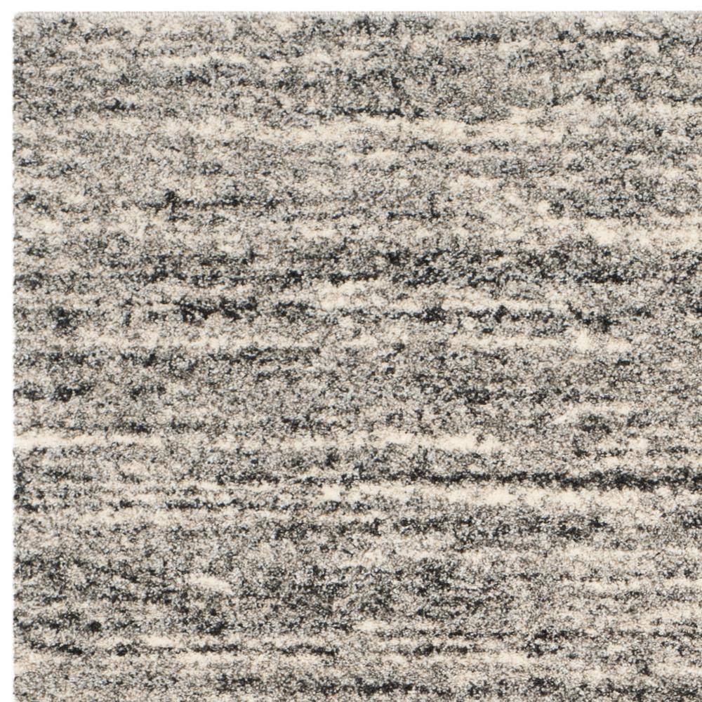 Ivory and Grey Abstract Synthetic Area Rug