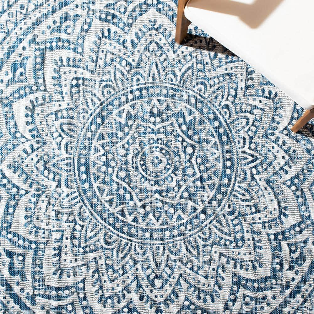 Ivory and Navy Geometric Round Synthetic Area Rug