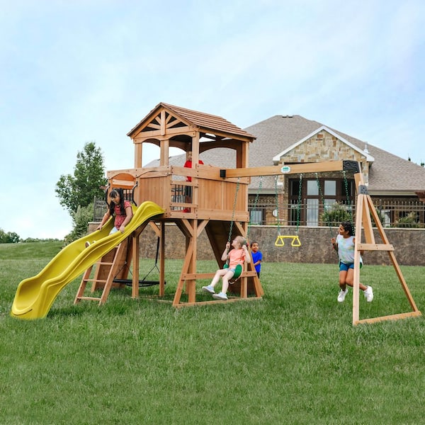 Backyard Discovery Sterling Point Outdoor Playground Set w/ Elevated Clubhouse, Balcony, Web Swing, Swing Set, and Yellow Wave Slide