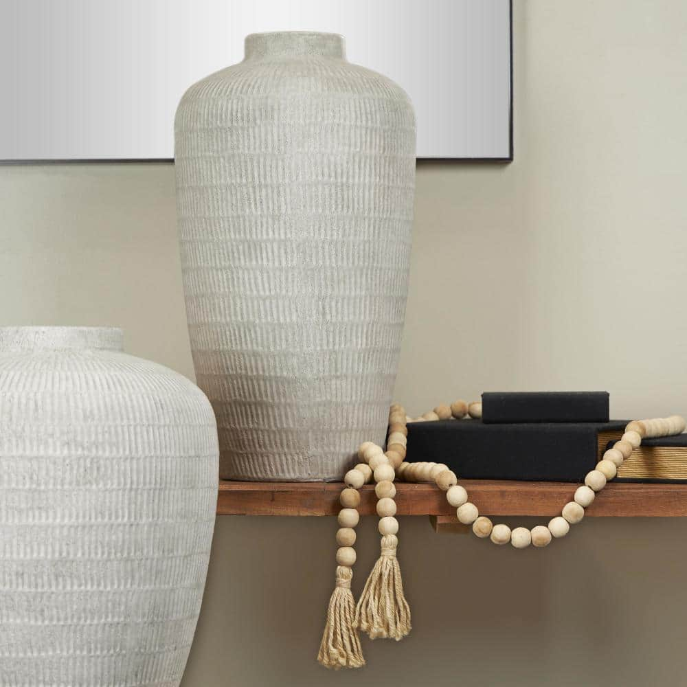 Litton Lane 23 in. Cream Textured Ceramic Decorative Vase with Linear Pattern