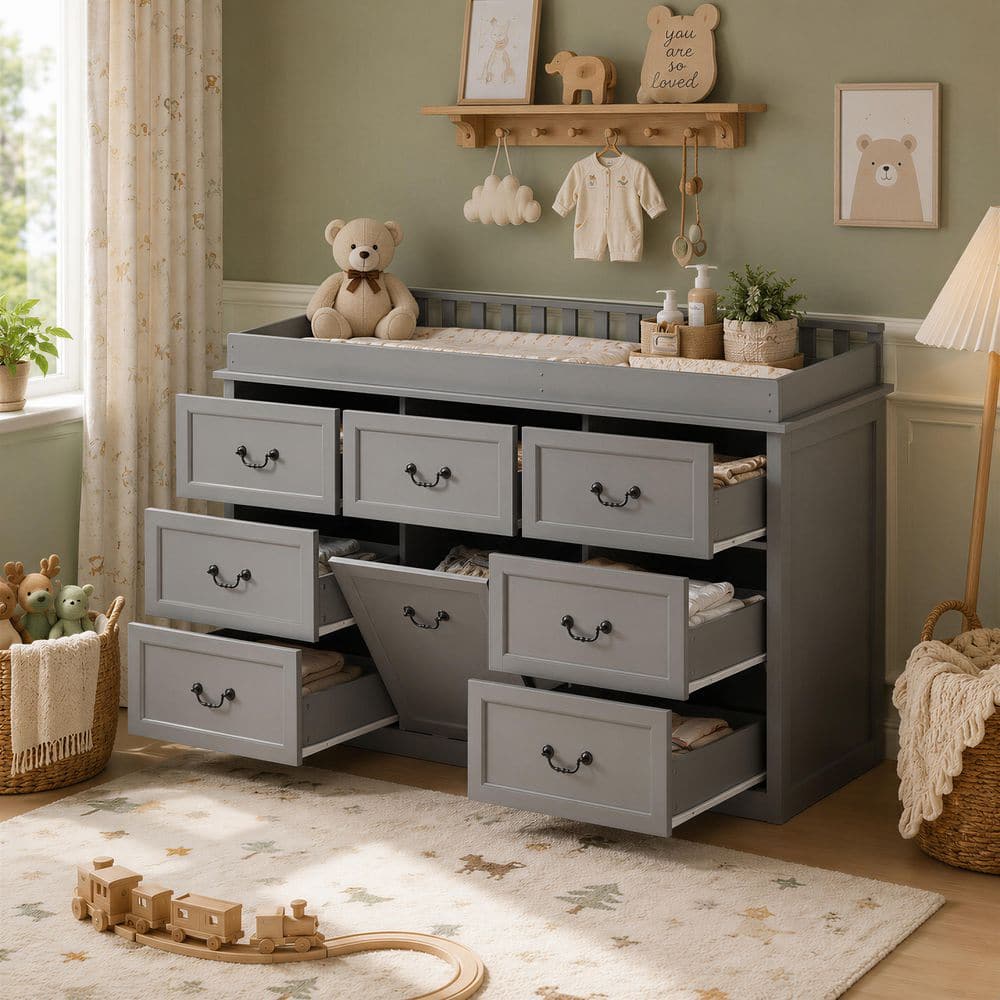 Gray pine wood dresser with changing table top and eight drawers in a nursery.