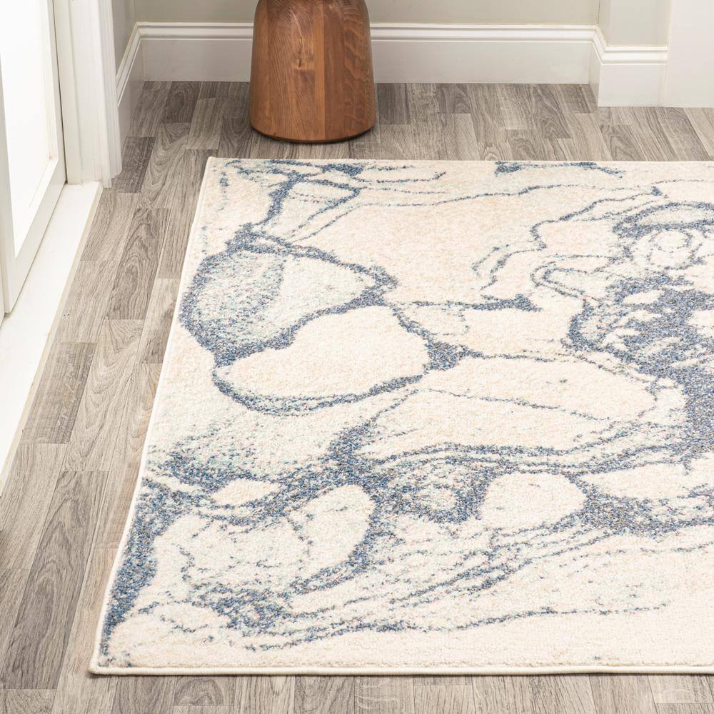 Blue and Cream Abstract 8' x 10' Synthetic Area Rug