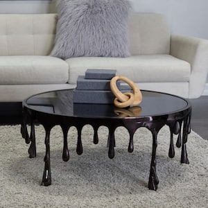 36 in. Black Medium Round Aluminum Drip Coffee Table with Melting Designed Legs and Shaded Glass Top