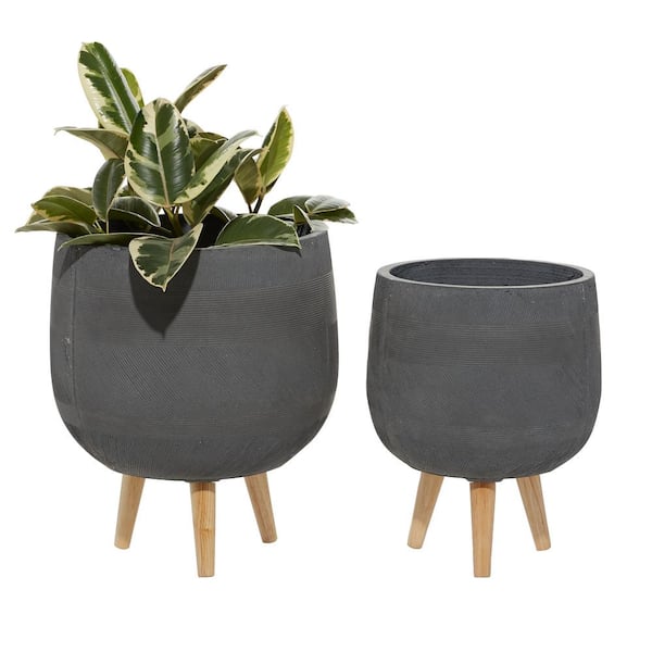 https://images.thdstatic.com/productImages/a6a8dacb-22a7-5de5-b9d2-36adc7627caa/svn/grey-litton-lane-plant-pots-46491-64_600.jpg