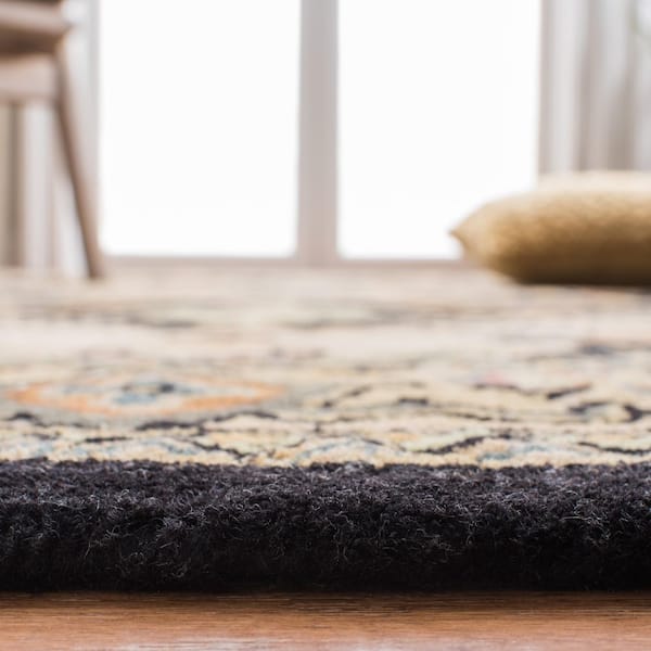 https://images.thdstatic.com/productImages/a6ad48ae-3e50-48f4-af30-d9012550e2b9/svn/black-gold-safavieh-area-rugs-hg625z-9-4f_600.jpg